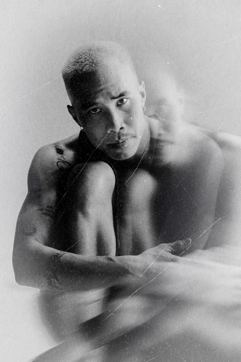 Man with blurred figure behind him